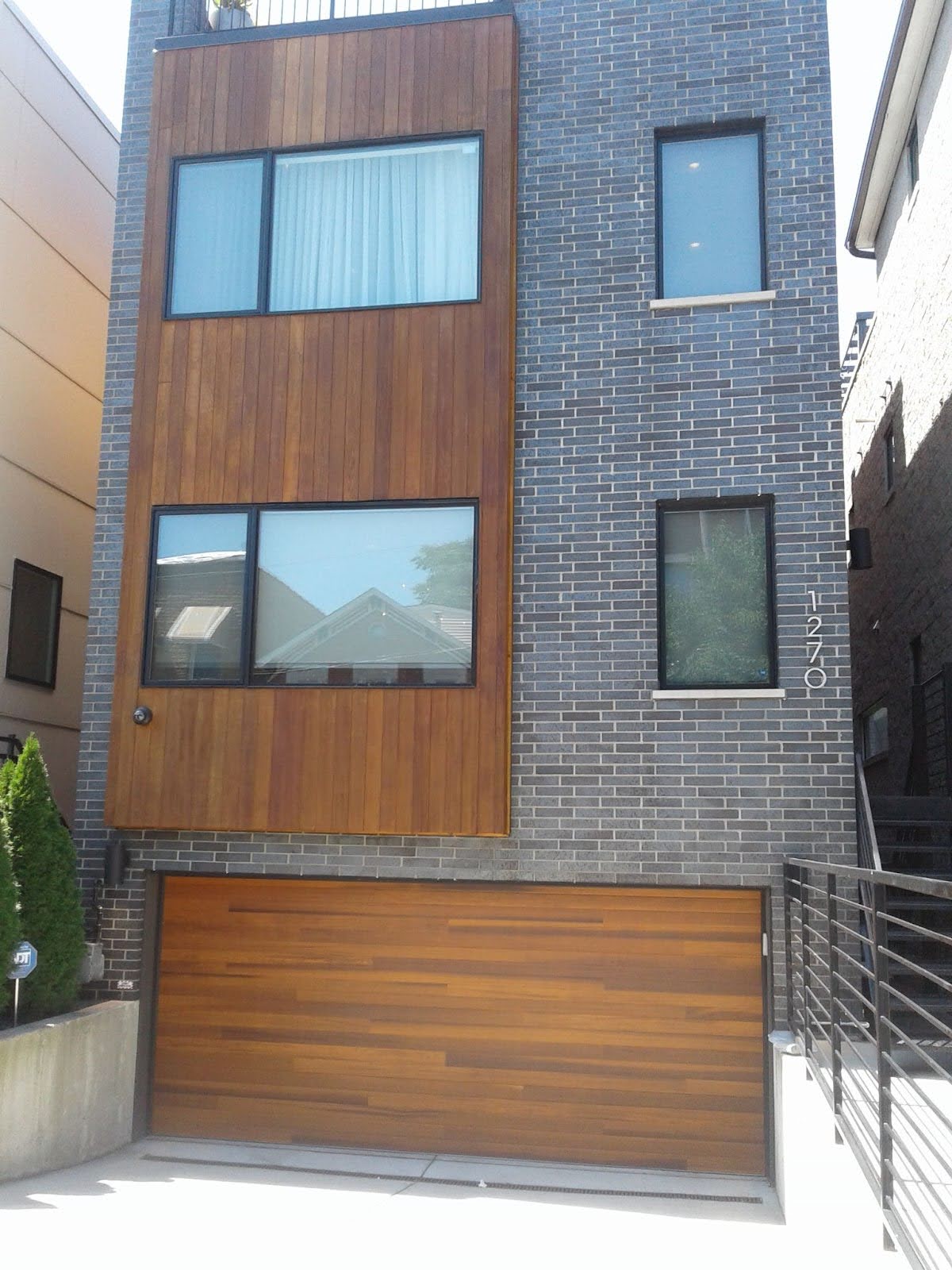 Cedar plank garage door installed by Robert's Garage Door Professionals